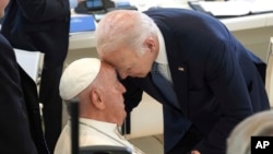 U.S. President Joe Biden, right, greets Pope Francis ahead of a working session on Artificial Intelligence (AI), Energy, Africa-Mediterranean, on day two of the 50th G7 summit at Borgo Egnazia, southern Italy, June 14, 2024.