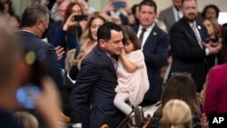 FILE - Assemblyman Anthony Rendon walks with his daughter Vienna before being sworn in as Speaker of the Assembly at the California Legislature in Sacramento, Calif., Dec. 5, 2022.