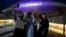 Dongdaemun Design Plaza is illuminated in purple as fans take a selfie in Seoul, South Korea, June 12, 2023.  Several landmarks in South Korea's capital will be lit in purple on Monday as the country celebrates the 10th anniversary of K-pop band BTS.