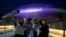 Dongdaemun Design Plaza is illuminated in purple as fans take a selfie in Seoul, South Korea, June 12, 2023. Under a new law that takes effect Wednesday, South Korea is adopting the international method that uses a person's actual date of birth to determine their age.