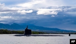 FILE - The fast-attack submarine USS Missouri departs Joint Base Pearl Harbor-Hickam for a scheduled deployment in the 7th Fleet area of responsibility, Sept. 1, 2021. The U.S. pledged April 26, 2023, to deploy more “strategic assets,” such as nuclear-capable submarines, long-range bombers and aircraft carriers, to South Korea. (U.S. Navy via AP)