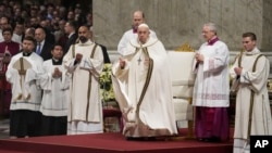 Pope Francis presides over Christmas Eve Mass, at St. Peter's Basilica at the Vatican, Dec. 24, 2023.
