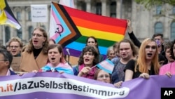 Demonstrators demand a law to protect the rights of the transgender community outside of the parliament Bundestag building in Berlin, April 12, 2024.