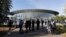 FILE - File - People stand outside of the Steve Jobs Theater before an event, Sept. 12, 2018. If Apple unveils a headset equipped with mixed reality technology Monday, it will be the company's biggest new product since the introduction of the Apple Watch.
