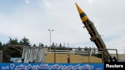 A new surface-to-surface ballistic missile called Khaibar with a range of 2,000 km, unveiled by Iran, is seen in Tehran, Iran. (WANA via Reuters)