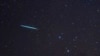 FILE - A meteor from the Geminids meteor shower enters Earth's atmosphere on Dec. 12, 2009, above Southold, N.Y. A meteor streaked across New York City's skyline and disintegrated over nearby New Jersey on July 16, 2024. 