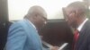 Transform Zimbabwe leader Jacob Ngarivhume talking to his attorney, Professor Lovemore Madhuku