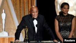 FILE - Honoree singer and social activist Harry Belafonte speaks after receiving the Oscar statuette for the Jean Hersholt Humanitarian Award, at the Academy of Motion Picture Arts and Sciences Governors Awards in Los Angeles, California, Nov. 8, 2014. 