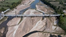 A view shows a bridge with sandbanks of a branch of the Loire River in Loireauxence, France, Oct. 17, 2023.