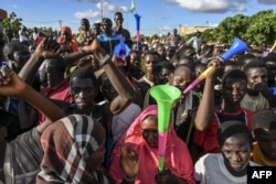 FILE - Supporters of Niger's National Council of Safeguard of the Homeland (CNSP), are seen outside a Nigerien airbase housing French troops in Niamey, Sept. 3, 2023, demanding their departure from Niger.