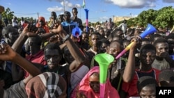 Supporters of Niger's National Council of Safeguard of the Homeland (CNSP), are seen outside a Nigerien airbase housing French troops in Niamey, Sept. 3, 2023, demanding their departure from Niger.