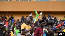 FILE — A crowd gathers to show support for Niger's junta at General Seyni Kountche Stadium in Niamey, Niger, Aug. 13, 2023. 