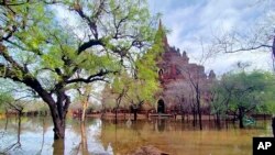 In this photo provided by Myanmar Military True News Information Team on Monday, May 15, 2023, a flooded area caused by Cyclone Mocha is seen near old temple in Bagan, central Myanmar.