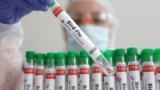 FILE - A person holds a test tube labeled "Bird Flu", in this picture illustration, January 14, 2023. (REUTERS/Dado Ruvic/Illustration/File Photo)