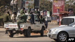 FILE - Zambian police officers patrol the streets in Lusaka, Aug. 13, 2016. 