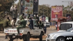 FILE - Zambian police officers patrol the streets in Lusaka, Aug. 13, 2016. Police arrested four members of a feminist group for allegedly planning a demonstration March 5, 2023, aimed at promoting homosexuality, while billing the rally as a protest against gender-based violence.