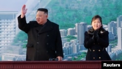 North Korean leader Kim Jong Un and his daughter, Kim Ju Ae, attend a ceremony for the construction of a new street in Pyongyang in this undated photo released on Feb. 26, 2023, by North Korea's Korean Central News Agency. (KCNA via Reuters)