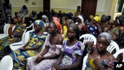 FILE - Chibok schoolgirls freed from Boko Haram captivity are seen in Abuja, Nigeria, May 7, 2017. 