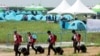 Participants for the 25th World Scout Jamboree arrive at a camping site in Buan, South Korea, Aug. 1, 2023. (Yonhap via Reuters)