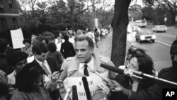 FILE - Singer Harry Belafonte talks to reporters near the South African Embassy in Washington, Nov. 28, 1984, as he walked a picket line protest apartheid in South Africa.