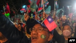 Supporters of Ko Wen-je, presidential candidate from the Taiwan People's Party (TPP), wave flags during a campaign rally in Kaohsiung, Jan. 7, 2024.