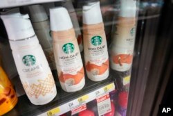 Starbucks' Pumpkin Spice Latte coffee creamers are displayed at a Target store, Aug. 23, 2023, in New York.