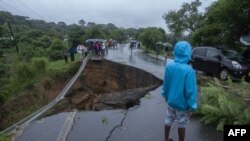 A general view of a collapsed road caused by flooding waters due to heavy rains following cyclone Freddy in Blantyre, Malawi, on March 13, 2013.