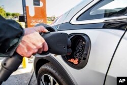 This photo shows the Combined Charging System, or CCS, plug. It had been the dominant standard for EV charging until automakers decided to switch to Tesla's standard. (General Motors via AP)