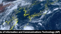 This satellite image provided by the National Institute of Information and Communications Technology shows Typhoon Khanun moving toward Okinawa, Japan, Aug. 1, 2023. 