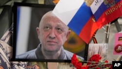 A portrait of the owner of private military company Wagner Group Yevgeny Prigozhin lays at an informal street memorial near the Kremlin in Moscow, Russia, Aug. 26, 2023. 