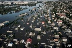 Streets are flooded in Kherson, Ukraine, June 7, 2023 after the walls of the Kakhovka dam collapsed.