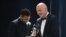FILE: Argentina and Paris Saint-Germain forward Lionel Messi (L) receives from FIFA President Gianni Infantino the Best FIFA Mens Player award during the Best FIFA Football Awards 2022 ceremony in Paris on February 27, 2023. 