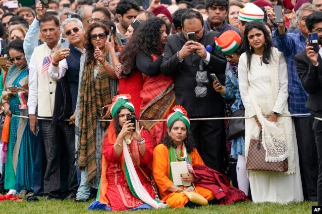 Guests arrive before President Joe Biden and first lady Jill Biden welcome India's Prime Minister Narendra Modi during a State Arrival Ceremony on the South Lawn of the White House, June 22, 2023, in Washington.