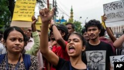 Protesters condemn the rape and murder of a doctor inside a government hospital in Kolkata, India, Aug. 14, 2024. 