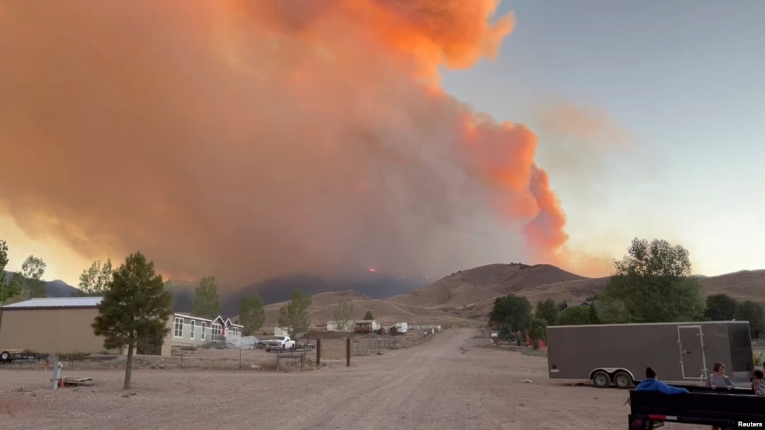 FILE - Fire and smoke rise from the Silver King Fire in Marysvale, Piute County, Utah, U.S., July 6, 2024 in this screen grab obtained from a social media video. (Trevor Urry/via Reuters) 