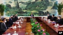 U.S. Secretary of State Antony Blinken, fourth left, meets with Chinese President Xi Jinping, center, and Wang Yi, Chinese Communist Party's foreign policy chief, third right, in the Great Hall of the People in Beijing, June 19, 2023. 