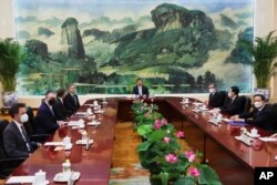 U.S. Secretary of State Antony Blinken, fourth left, meets with Chinese President Xi Jinping, center, and Wang Yi, Chinese Communist Party's foreign policy chief, third right, in the Great Hall of the People in Beijing, June 19, 2023.