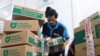 An employee packs goods at Goto's e-commerce unit Tokopedia's warehouse in Jakarta, Indonesia, August 31, 2022. REUTERS/Ajeng Dinar Ulfiana
