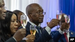 Michel Patrick Boisvert, who was named interim prime minister by the cabinet of outgoing Prime Minister Ariel Henry, toasts the transitional council that will select Haiti's new prime minister and cabinet in Port-au-Prince, Haiti, April 25, 2024.
