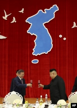 FILE - North Korean leader Kim Jong-un, right, toasts with South Korean then-President Moon Jae-in during a welcome banquet in Pyongyang, North Korea, on Sept. 18, 2018.