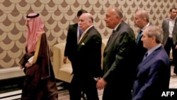 Saudi Arabia's Foreign Minister Faisal bin Farhan, Arab League Secretary-General Ahmed Aboul-Gheit, Egyptian Foreign Minister Sameh Shoukry, Syrian Foreign Minister Faisal Mekdad arrive for a regional meeting on Syria, in Amman on May 1, 2023.