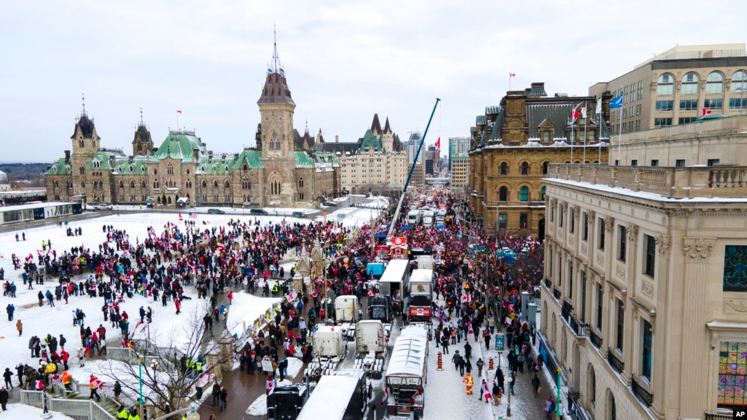 FILE - Truck drivers and others protest COVID-19 pandemic restrictions in Ottawa, Ontario, Feb. 12, 2022. 