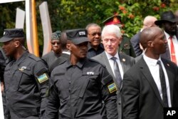 Former US President Bill Clinton leaves after laying a wreath at the Kigali Genocide Memorial in Kigali, Rwanda, on April 7, 2024.