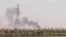 FILE - A picture taken from Omdurman shows smoke billowing north of Khartoum, Sudan, July 22, 2023, as fighting between the country's army and a rival military faction continues.