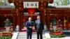 In this photo released by Xinhua News Agency, Chinese President Xi Jinping, right and German Chancellor Olaf Scholz pose in Beijing, China, April 16, 2024.