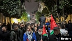 
Palestinians take part in a protest against the killing of senior Hamas official, Saleh al-Arouri, in Ramallah in the Israeli-occupied West Bank Jan. 2, 2024.
