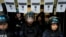 FILE - Police stand guard outside the National Institute against Discrimination, Xenophobia, and Racism, to prevent workers from entering after they were laid off in Buenos Aires, Argentina, April 3, 2024.