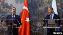 Russian Foreign Minister Sergei Lavrov, right, and Turkish Foreign Minister Hakan Fidan hold a press conference in Moscow, Aug. 31, 2023. Media reports say the Turkish minister expressed support for U.N. proposals to revive the Black Sea grain deal.