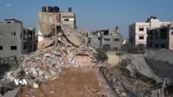 دیمەنی وێرانبوونی باڵەخانەیەکی نیشتەجێبوون لە غەززە و گەڕان بە دوای بێسەروشوێنبوواندا