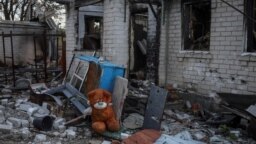 FILE - A stuffed toy bear is seen amid the wreckage of a building destroyed during Russia's attacks on Ukraine, in the village of Kamyanka, in Ukraine's Kharkiv region, Sept. 22, 2022.